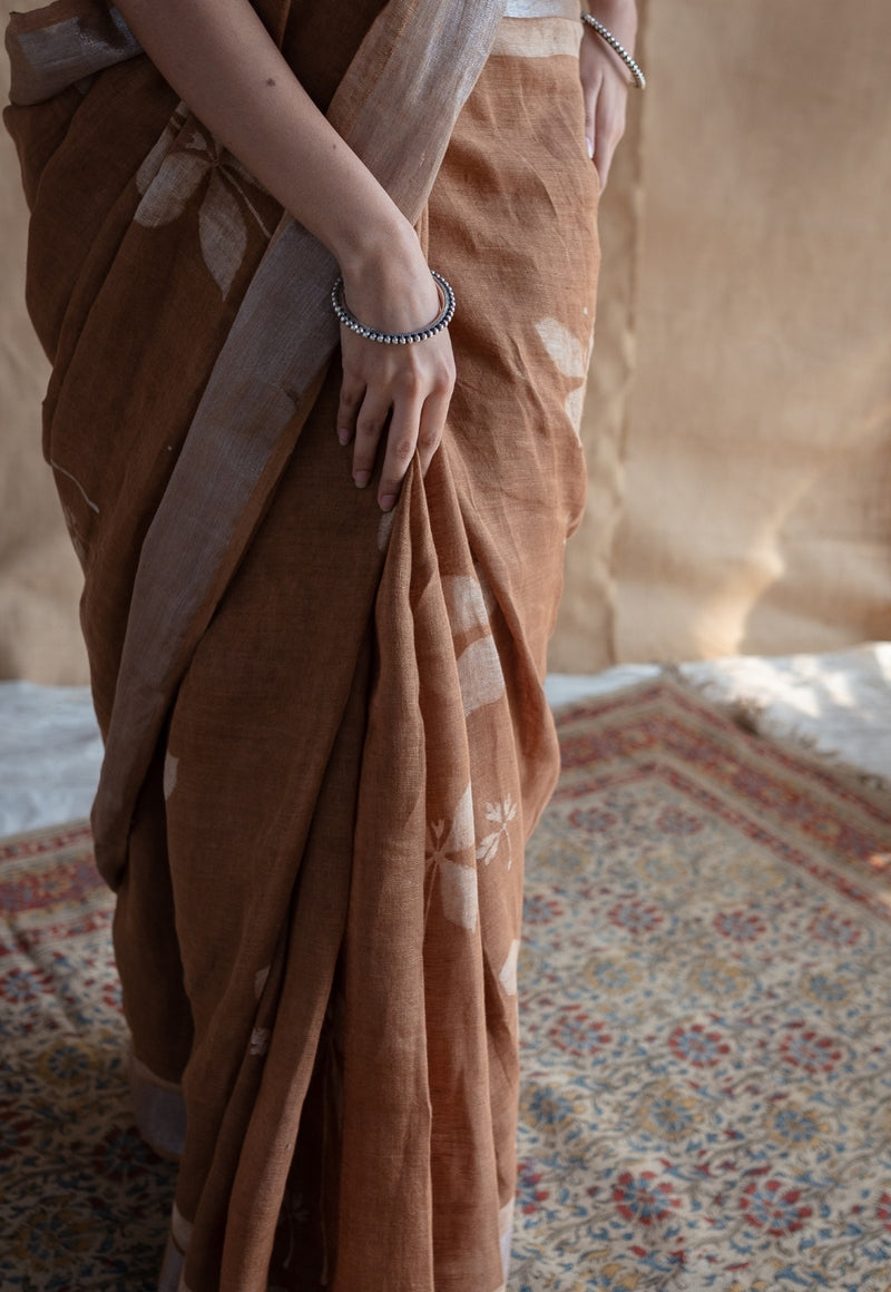 Light Brown Floral Butti Dabu Linen Silver Zari Border Saree