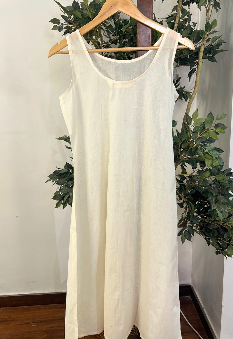Off White Solid Mul Cotton A Line Slip